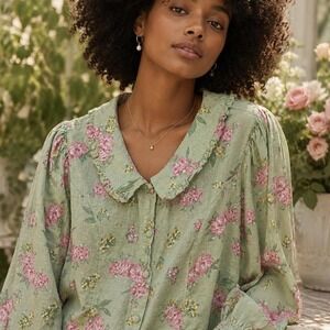 Pink floral button up blouse with ruffle collar and long sleeves